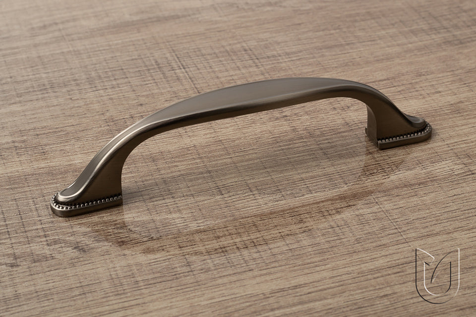 Buton mobilier Tulip Tomo – cupru antichizat închis (old copper dark), oval, 38 × 19 mm, cu șurub